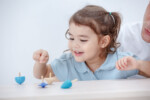 PlanToys Spinning Tops – Wooden Toy Set of 4 Tops in Different Colors for Kids - view 6