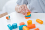 PlanToys Stacking Game – Wooden Dice Stacking Game with 12 Colorful Blocks for Kids - view 3